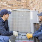 Top 5 HVAC Marketing Tips for Fall 2026 Multi-ethnic team of blue collar air conditioner repairmen at work.
