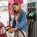 How Direct Mail Drove Fuel, Coffee, and Meal Deal Redemptions for a Leading Convenience Store Chain Smiling Woman Refueling Car at Gas Station