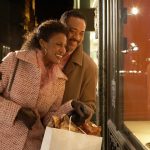 Holiday Spending Survey: Consumers eager to shop, celebrate and save Couple looking in store window at night, smiling