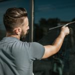 Home maintenance franchise shared mail case study: 4:1 ROAS Window cleaner on his job